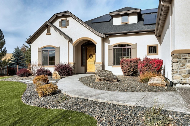 5826 W Shadow Run Ct, Boise, ID 83714 - view of front of home with stone siding, stucco siding, and solar panels