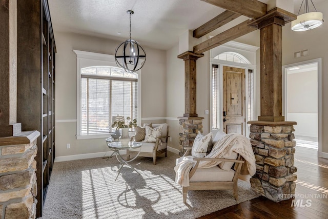5826 W Shadow Run Ct, Boise, ID 83714 - sitting room featuring ornate columns, a chandelier, and baseboards