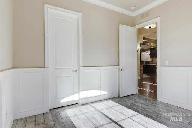 interior space with crown molding