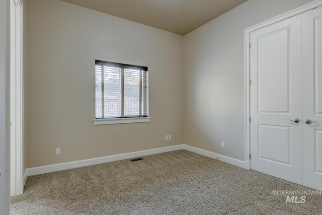 view of carpeted spare room