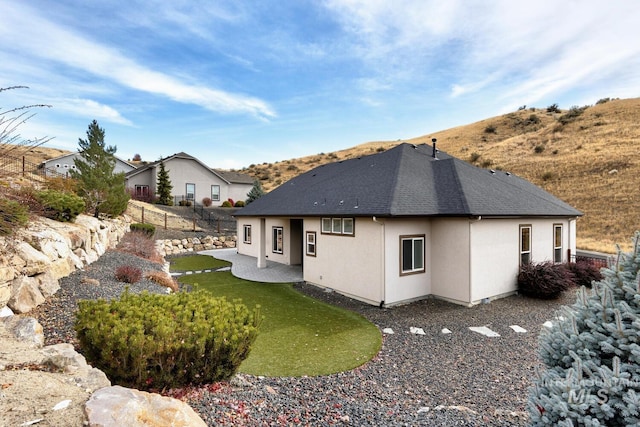 back of property with a patio area