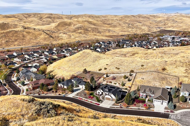 birds eye view of property featuring a mountain view