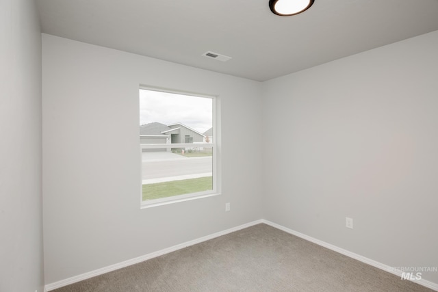 empty room with carpet flooring