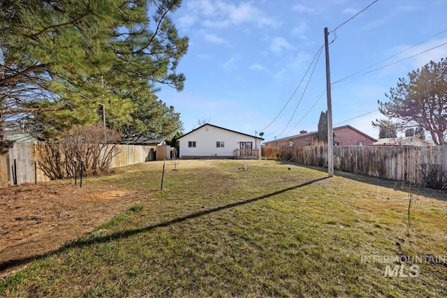 view of yard with a fenced backyard