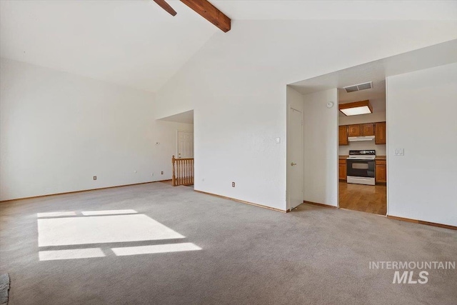 spare room featuring visible vents, baseboards, light colored carpet, beam ceiling, and high vaulted ceiling