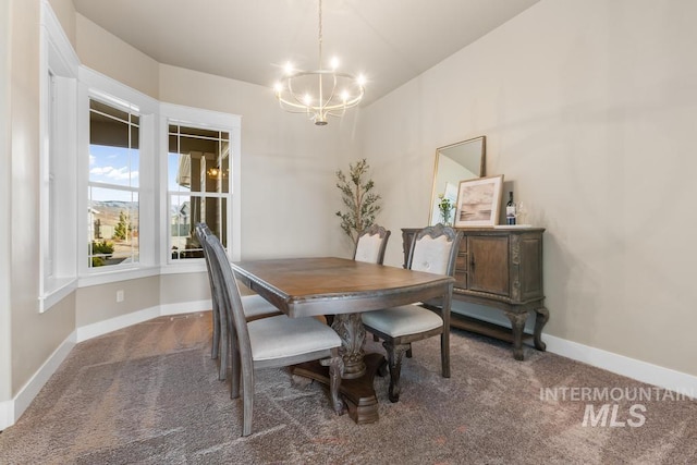 dining room with baseboards, a notable chandelier, and carpet flooring