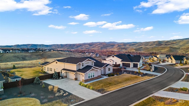 drone / aerial view featuring a mountain view and a residential view