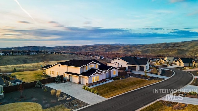 birds eye view of property with a residential view and a mountain view