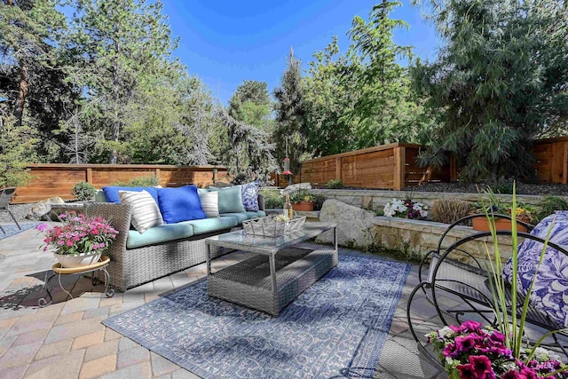 view of patio with a fenced backyard and outdoor lounge area
