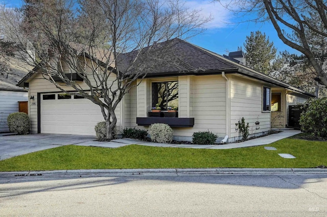 single story home with concrete driveway, a chimney, roof with shingles, an attached garage, and a front yard
