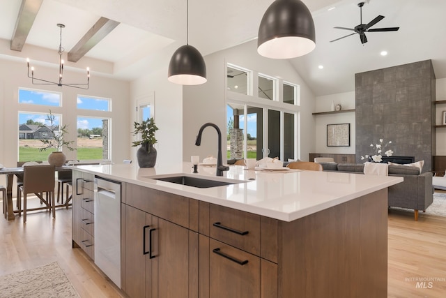 24910 Ardmore Ct, Caldwell, ID 83607 - kitchen with a sink, modern cabinets, light wood-style flooring, dishwasher, and high vaulted ceiling