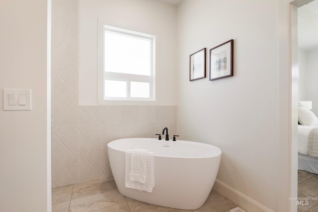 24910 Ardmore Ct, Caldwell, ID 83607 - ensuite bathroom with a freestanding tub and tile walls
