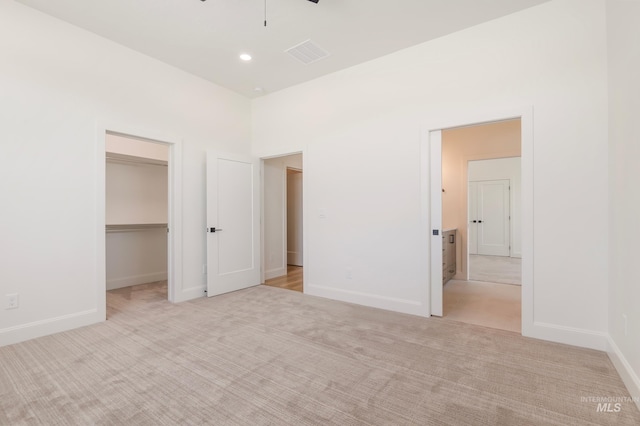 24910 Ardmore Ct, Caldwell, ID 83607 - unfurnished bedroom with a walk in closet, light colored carpet, baseboards, and a closet