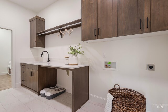 24910 Ardmore Ct, Caldwell, ID 83607 - washroom featuring hookup for an electric dryer, washer hookup, cabinet space, and baseboards