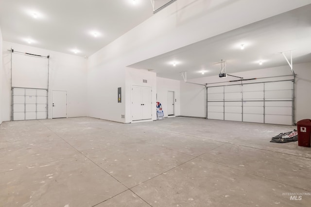 24910 Ardmore Ct, Caldwell, ID 83607 - garage featuring a garage door opener and electric panel