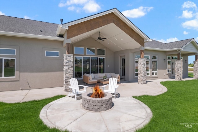 24910 Ardmore Ct, Caldwell, ID 83607 - back of house with stucco siding, a patio area, a lawn, ceiling fan, and an outdoor living space with a fire pit