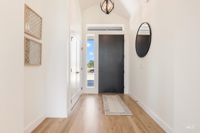 24910 Ardmore Ct, Caldwell, ID 83607 - foyer entrance with light wood-style floors, baseboards, and vaulted ceiling