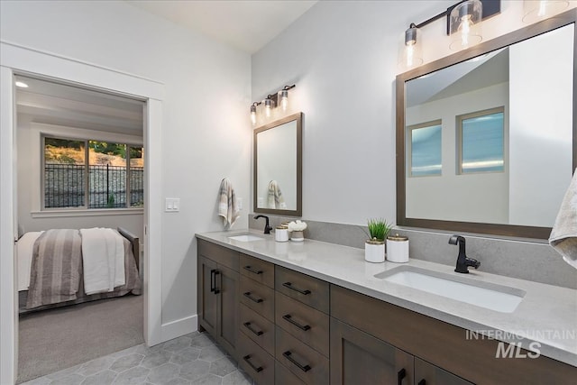 bathroom with tile patterned flooring and vanity