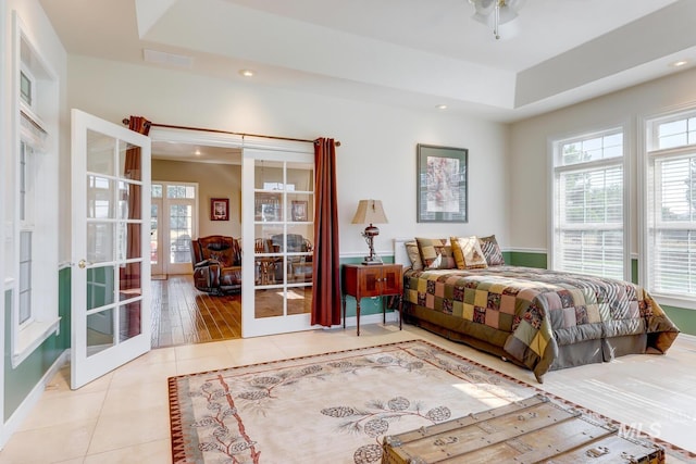 1795 W Black Canyon Hwy, Emmett, ID 83617 - bedroom featuring tile patterned flooring, french doors, recessed lighting, a tray ceiling, and visible vents