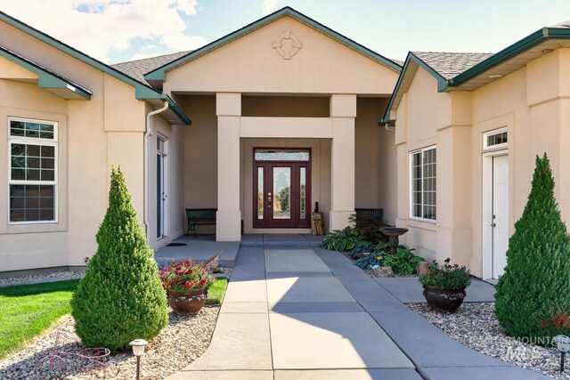 1795 W Black Canyon Hwy, Emmett, ID 83617 - property entrance featuring a shingled roof and stucco siding