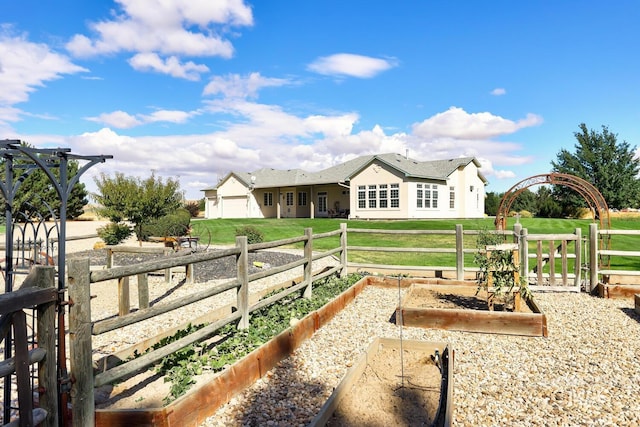 1795 W Black Canyon Hwy, Emmett, ID 83617 - view of yard featuring a garage, fence, and a vegetable garden