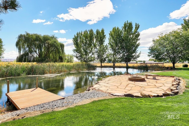 1795 W Black Canyon Hwy, Emmett, ID 83617 - view of dock featuring a patio, a water view, a yard, and a fire pit