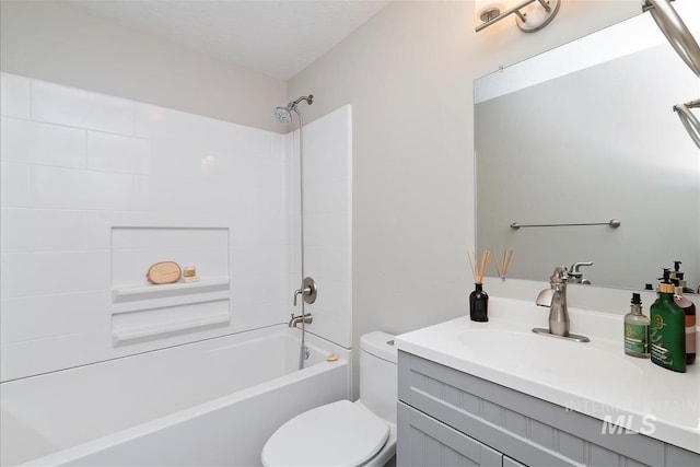 full bath featuring shower / bath combination, vanity, and toilet