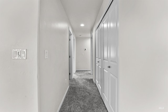 hallway with carpet flooring, baseboards, and recessed lighting