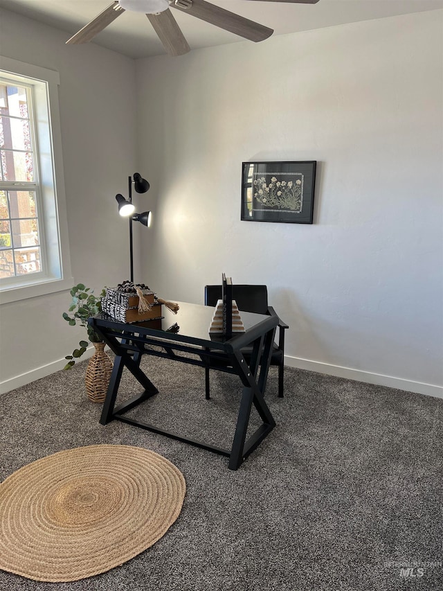 home office with ceiling fan and carpet flooring