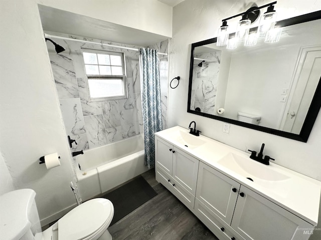 full bathroom with hardwood / wood-style floors, shower / bath combo, toilet, and vanity