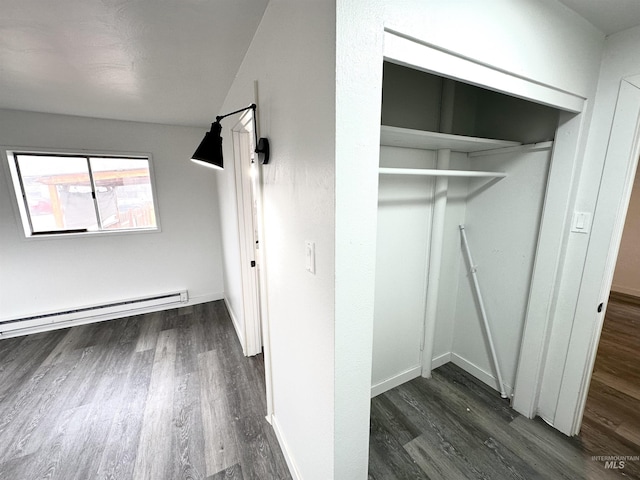 closet with a baseboard heating unit