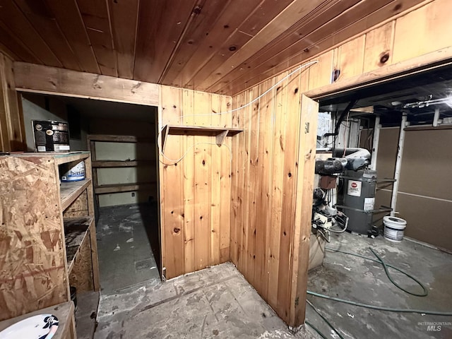 interior space featuring wooden walls and wood ceiling