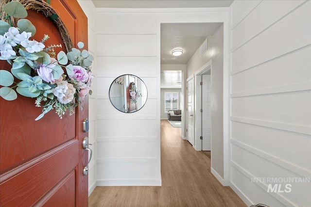 hallway with light wood-type flooring