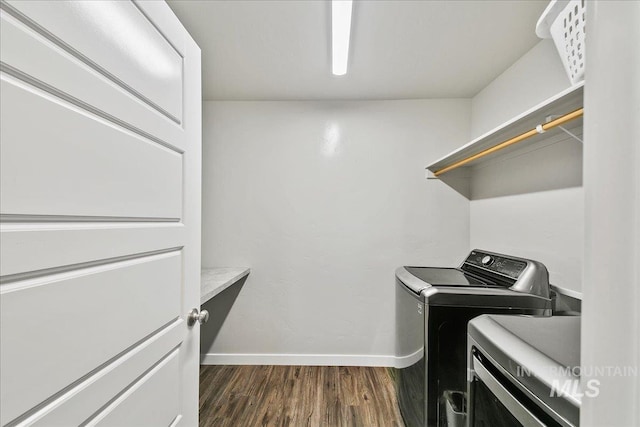 laundry area featuring dark hardwood / wood-style floors and independent washer and dryer