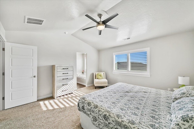 carpeted bedroom with ceiling fan and vaulted ceiling