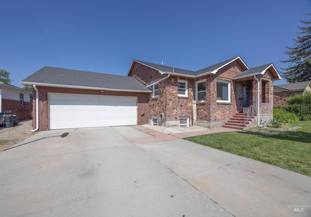 209 N Canyon St, Nampa, ID 83651 - ranch-style house featuring driveway, a front lawn, a garage, and brick siding