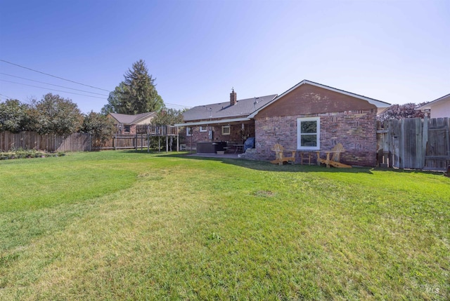209 N Canyon St, Nampa, ID 83651 - back of house featuring a patio, a chimney, and brick siding