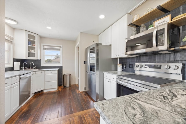 209 N Canyon St, Nampa, ID 83651 - kitchen with appliances with stainless steel finishes, dark wood-style floors, a sink, light stone countertops, and recessed lighting