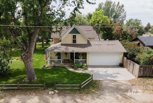 221 N Union St, Star, ID 83669 - view of front of home featuring a porch, an attached garage, concrete driveway, and a shingled roof