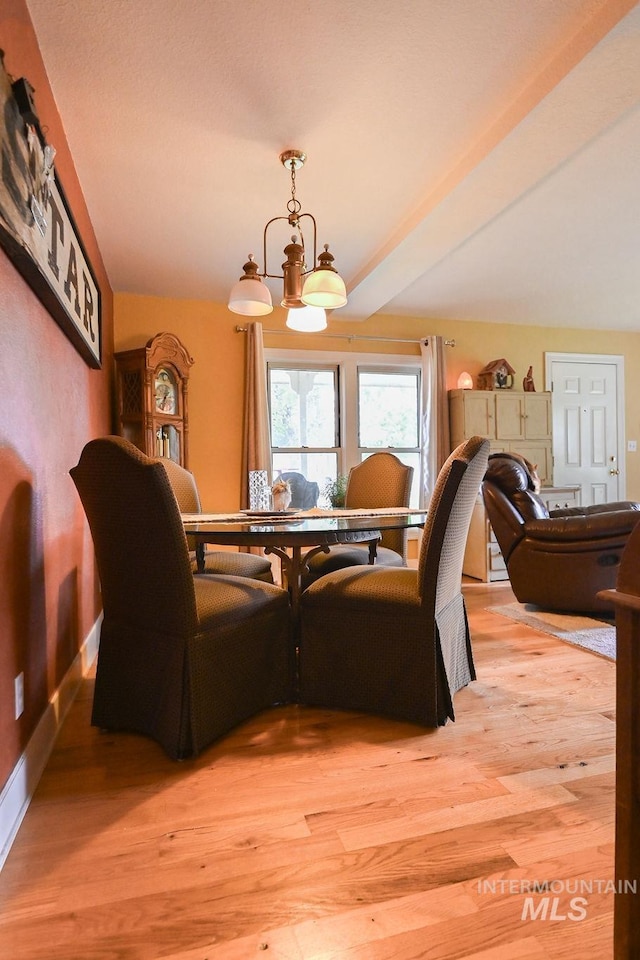 221 N Union St, Star, ID 83669 - dining area with light wood finished floors, a chandelier, and baseboards