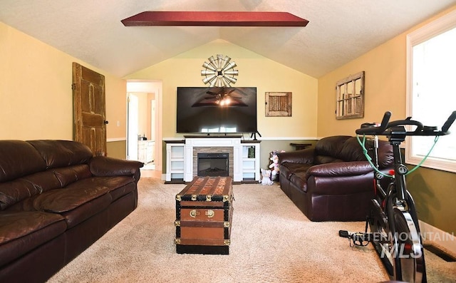 221 N Union St, Star, ID 83669 - living area with lofted ceiling, carpet floors, a stone fireplace, and a ceiling fan
