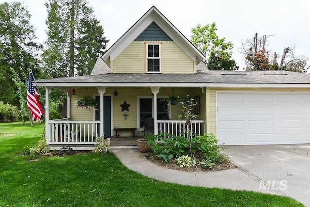 221 N Union St, Star, ID 83669 - farmhouse-style home featuring covered porch, concrete driveway, a front yard, a garage, and roof with shingles