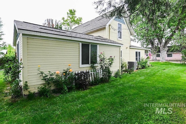 221 N Union St, Star, ID 83669 - view of side of property with a lawn and roof with shingles