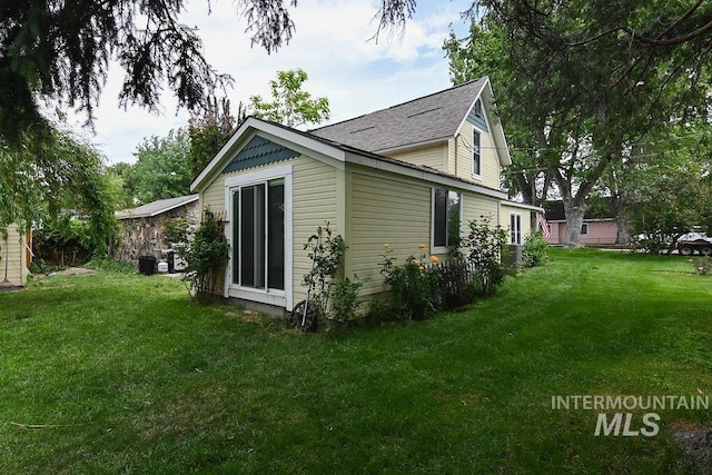 221 N Union St, Star, ID 83669 - view of property exterior featuring a yard and roof with shingles