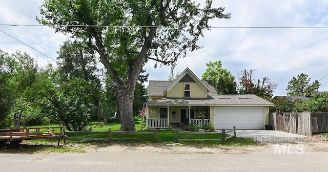 221 N Union St, Star, ID 83669 - view of front of home featuring a garage, covered porch, and driveway