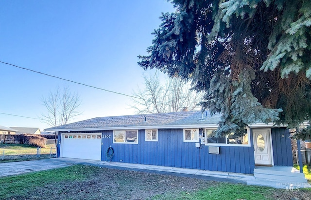 view of front of house with a garage and a front yard