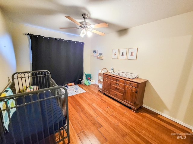 bedroom featuring ceiling fan and light wood-type flooring