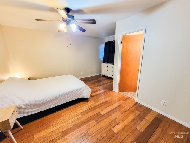 bedroom featuring hardwood / wood-style flooring and ceiling fan