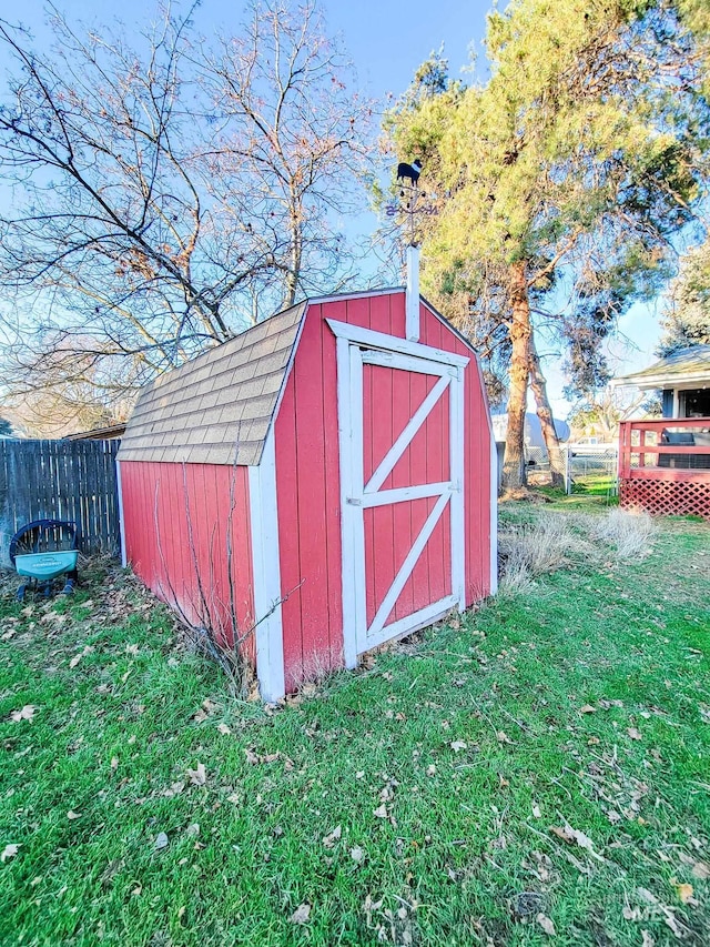 view of outbuilding with a yard