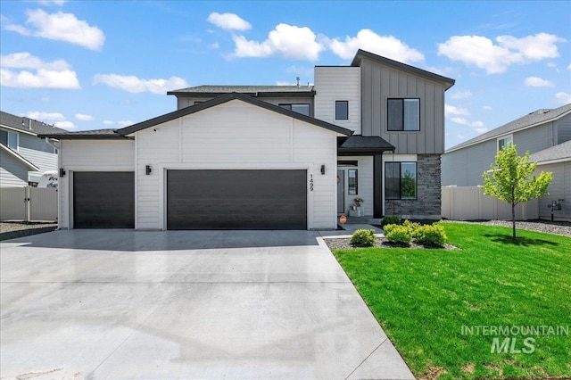 1499 W Blue Downs St, Meridian, ID 83642 - contemporary home with board and batten siding, a garage, and driveway